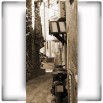 Fototapeta wąska uliczka w kolorze sepii