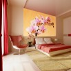 Fototapeta łososiowa orchidea - aranżacja sypialni